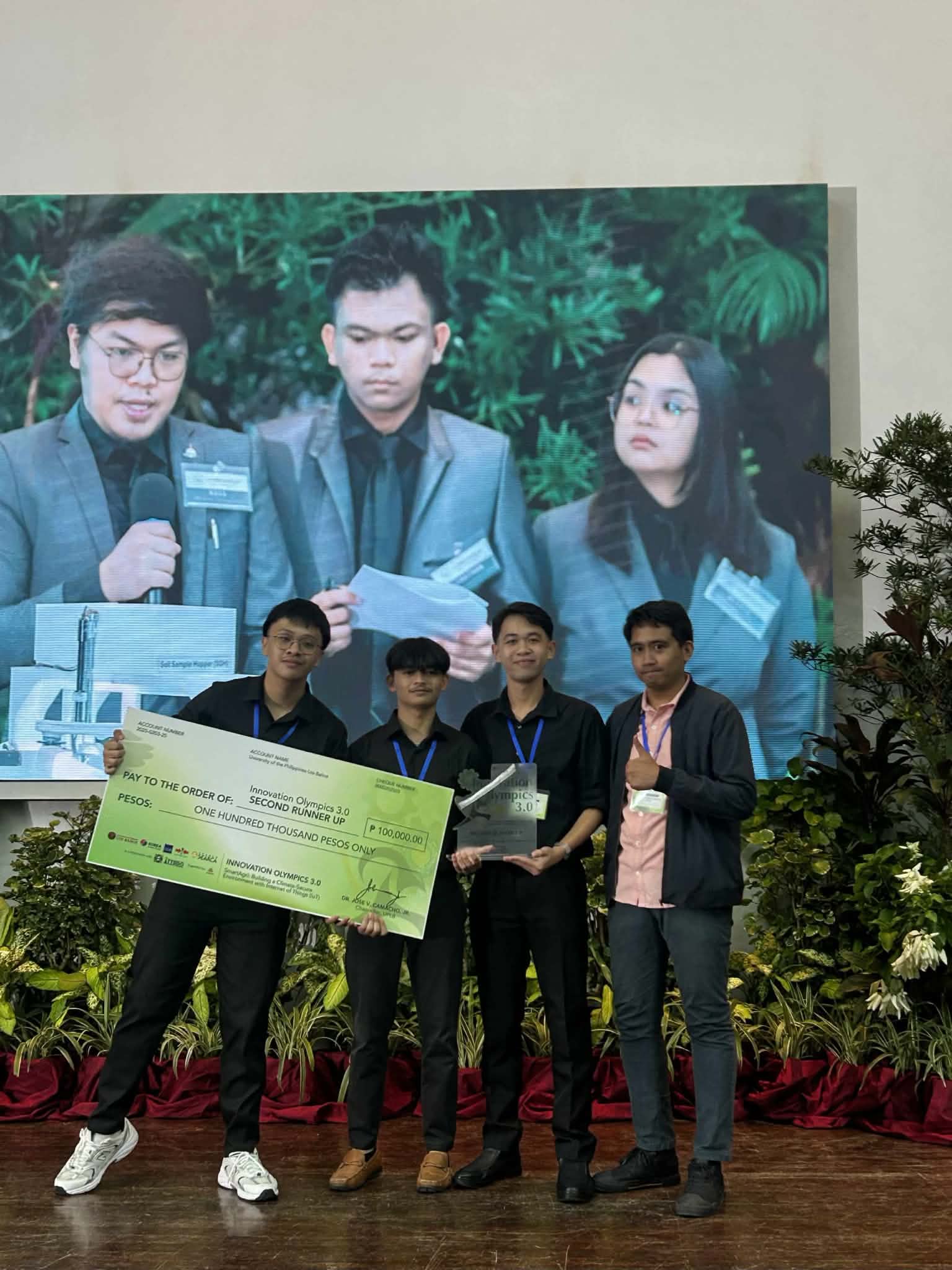 Receiving an innovation competition award with teammates